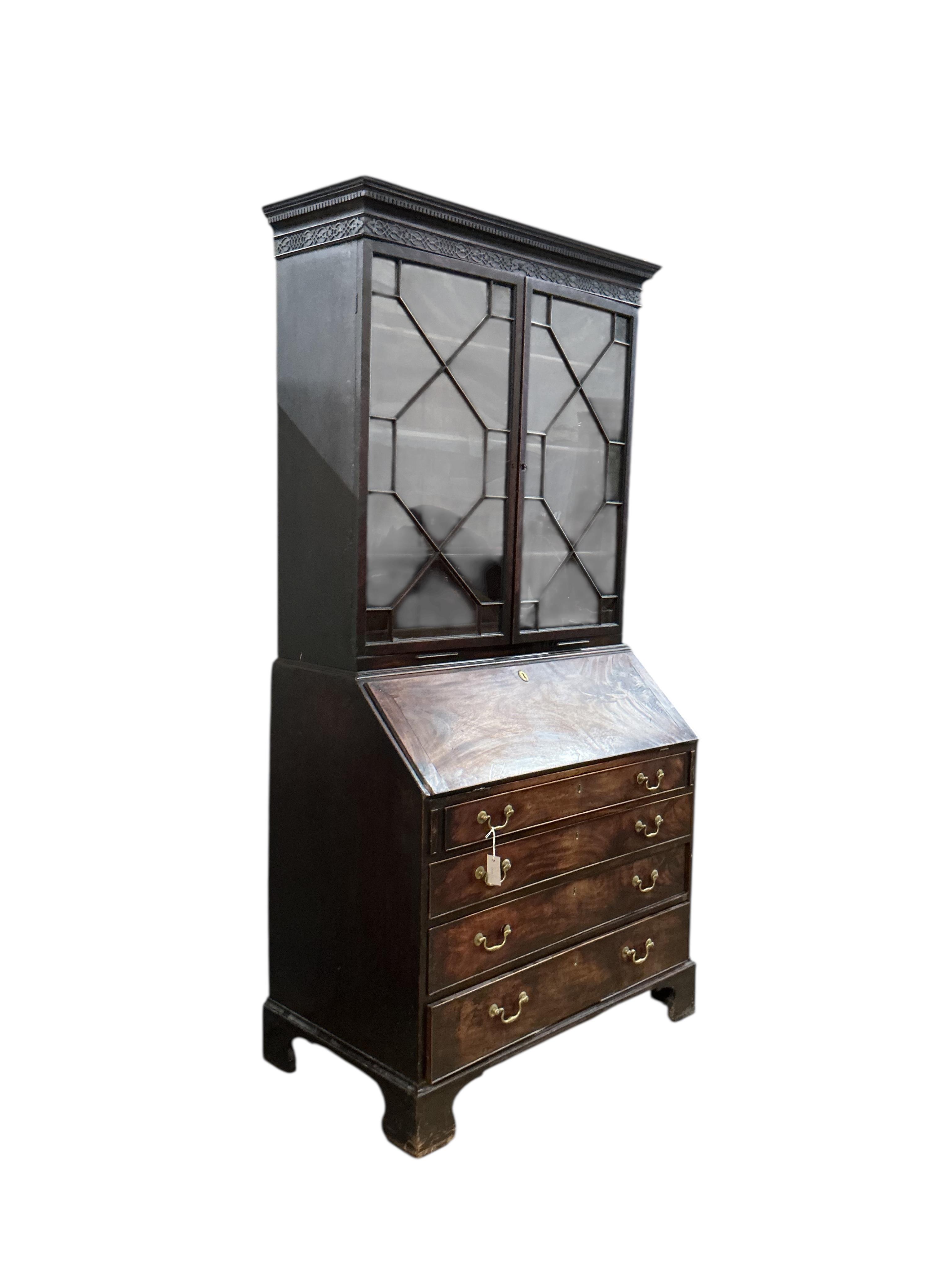 A George III mahogany bureau bookcase, width 112cm, depth 61cm, height 218cm